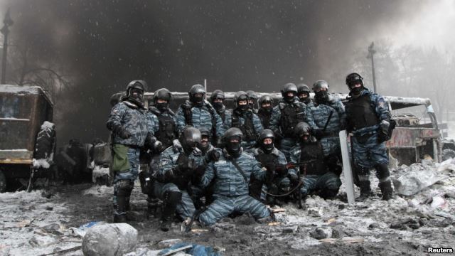 Riot police posing for a group photo after scattering the protesters in Kyiv, Ukraine